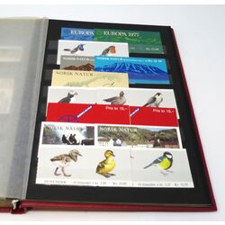 denmark collection in a red stockbook