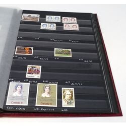 canada mint collection in a red stockbook