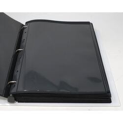 60 used black stock sheets in binder